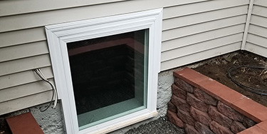 basement window installed view from outside of house